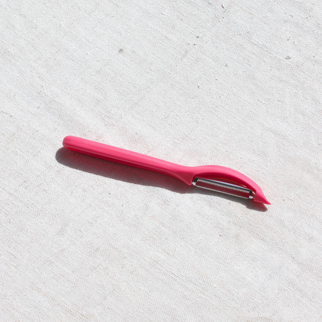 Économe rouge pastel Victorinox