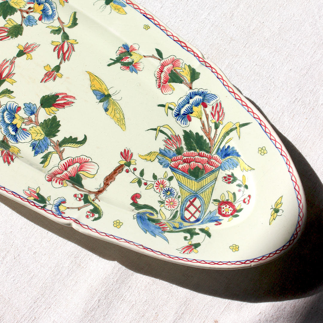 Plat à poisson au décor d’oiseaux et papillons Gien