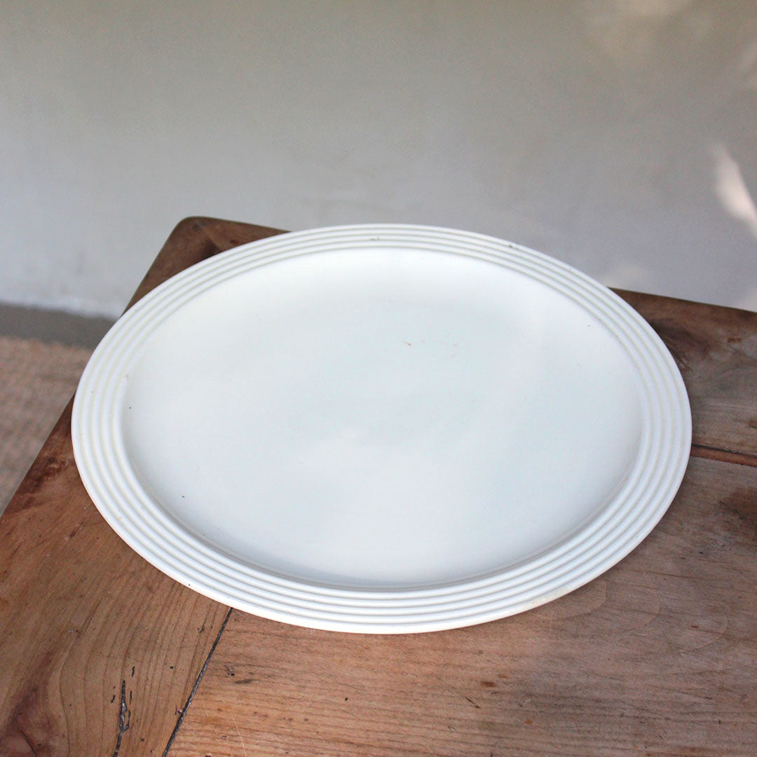 Plat rond en faïence ancienne
