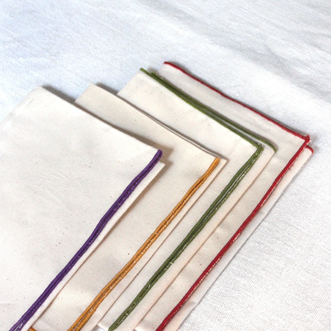 Quatre serviettes en coton écru