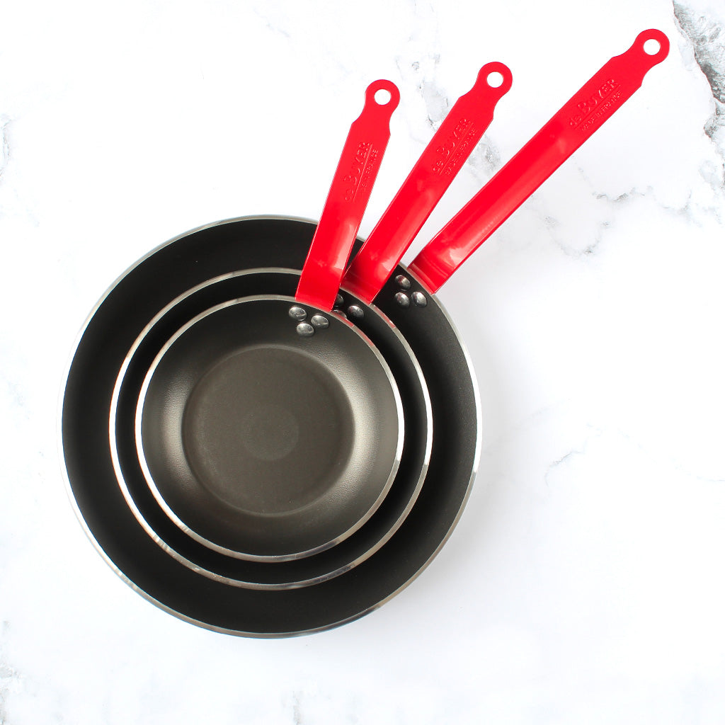 poêle antiadhésive queue rouge