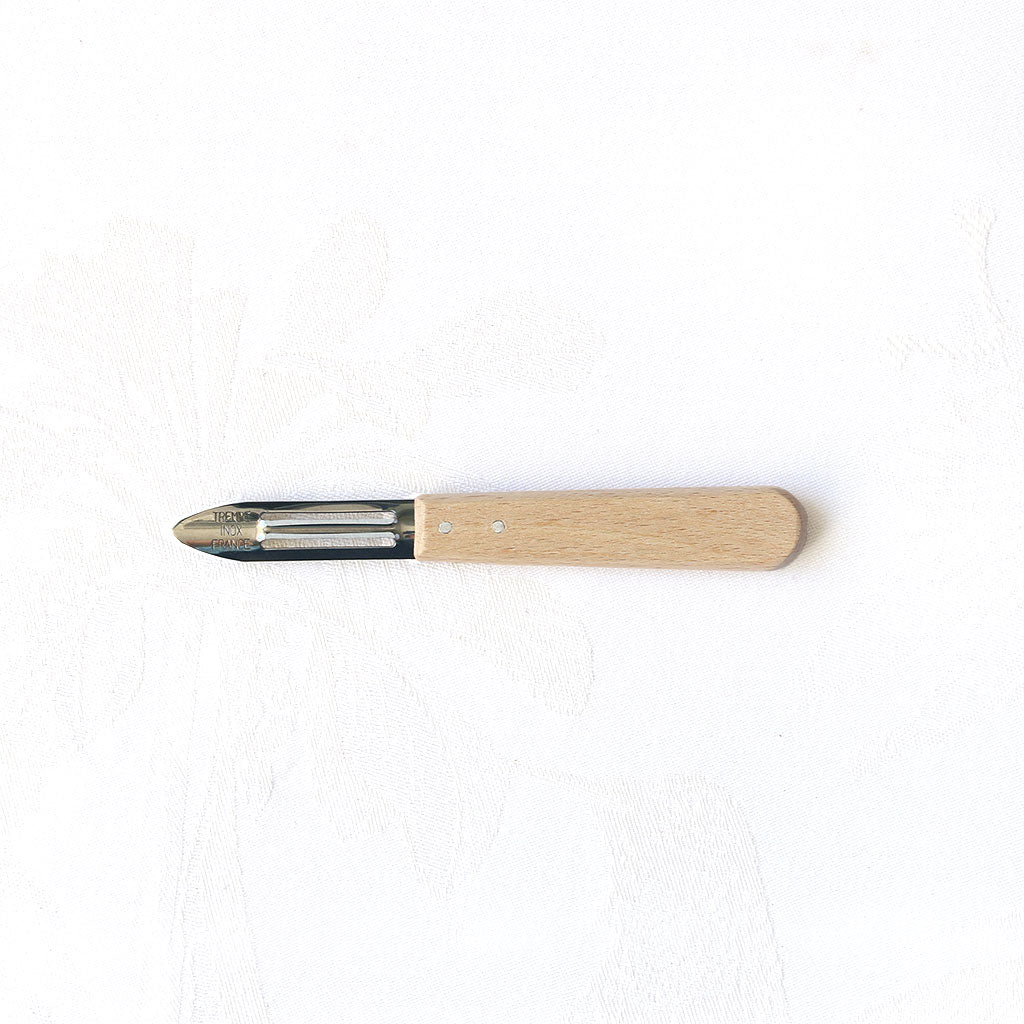 Économe en inox et manche en hêtre