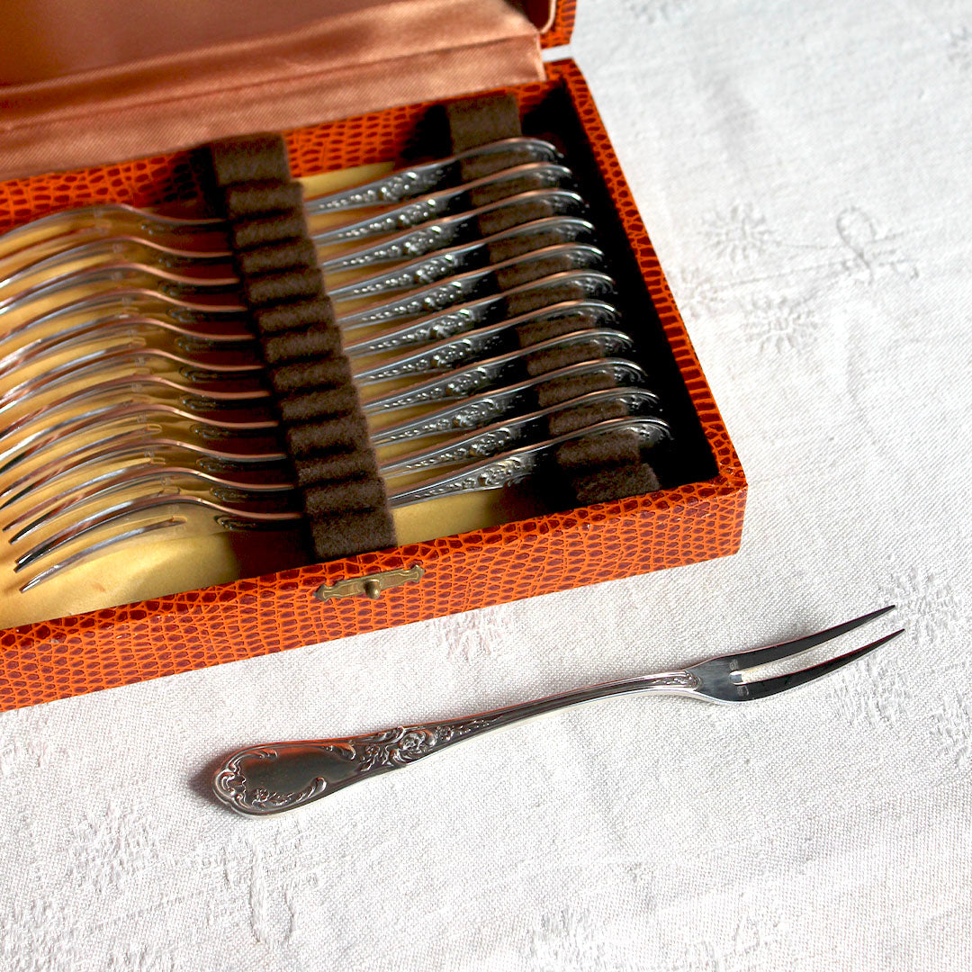 12 fourchettes à escargot en métal argenté