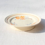 Assiette sur pied au décor de fleurs orange