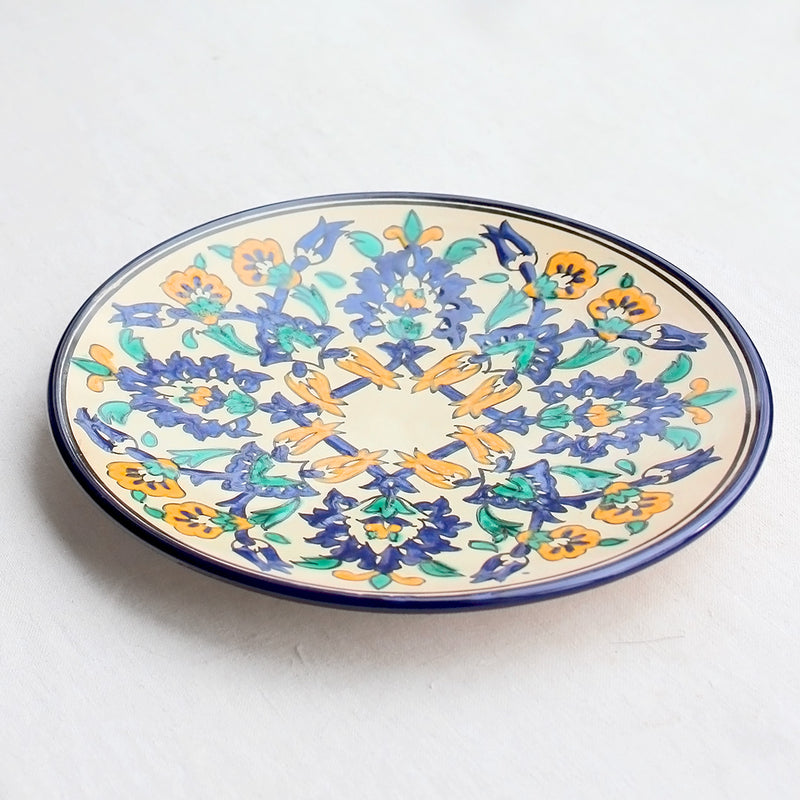Grand plat rond en céramique vernissée